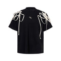 Black loose fit short sleeve T-shirt with padded shoulder and rivet ribbon detail