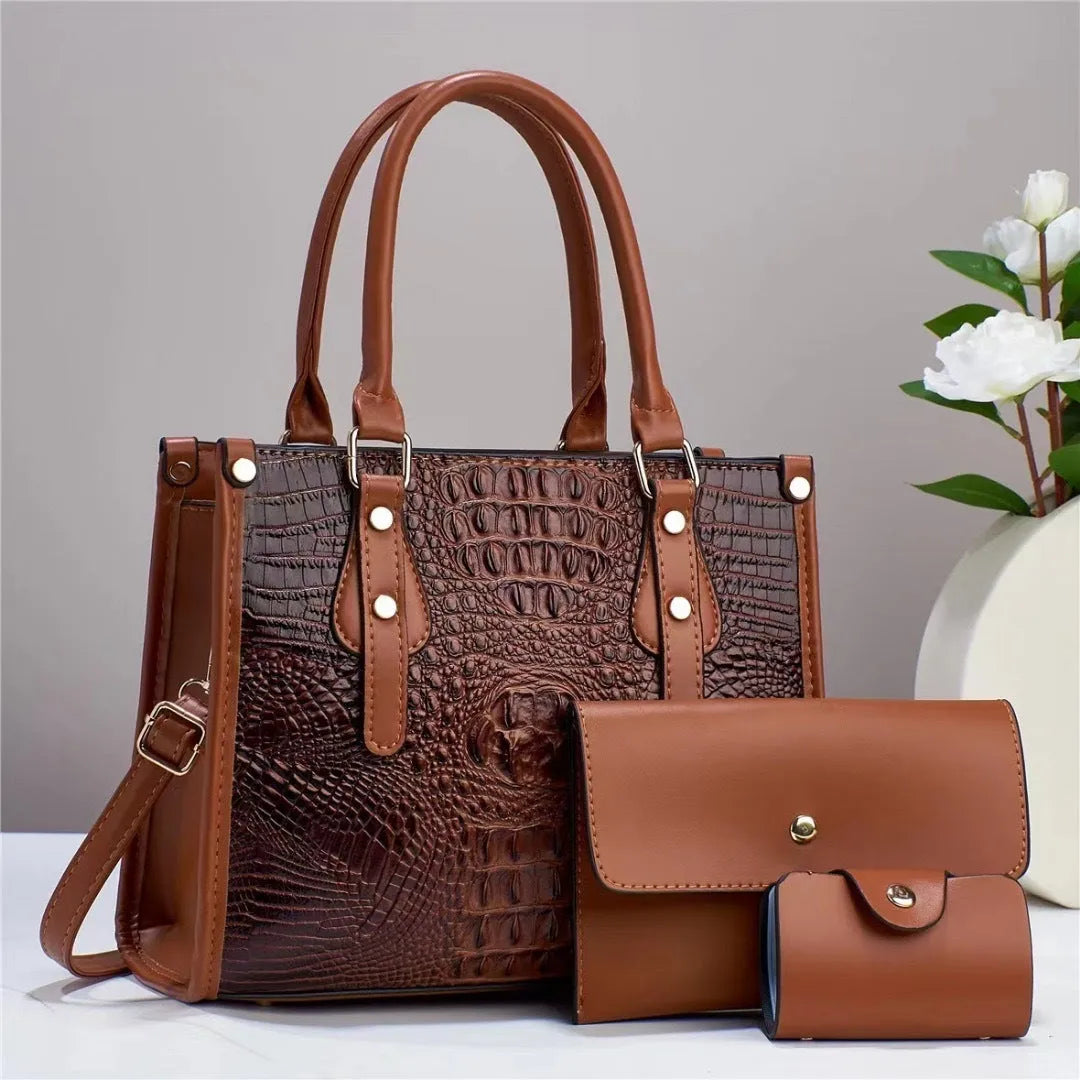 Women's textured PU leather three-piece travel bag set showing crossbody bag, wallet and card holder in coordinated colour
