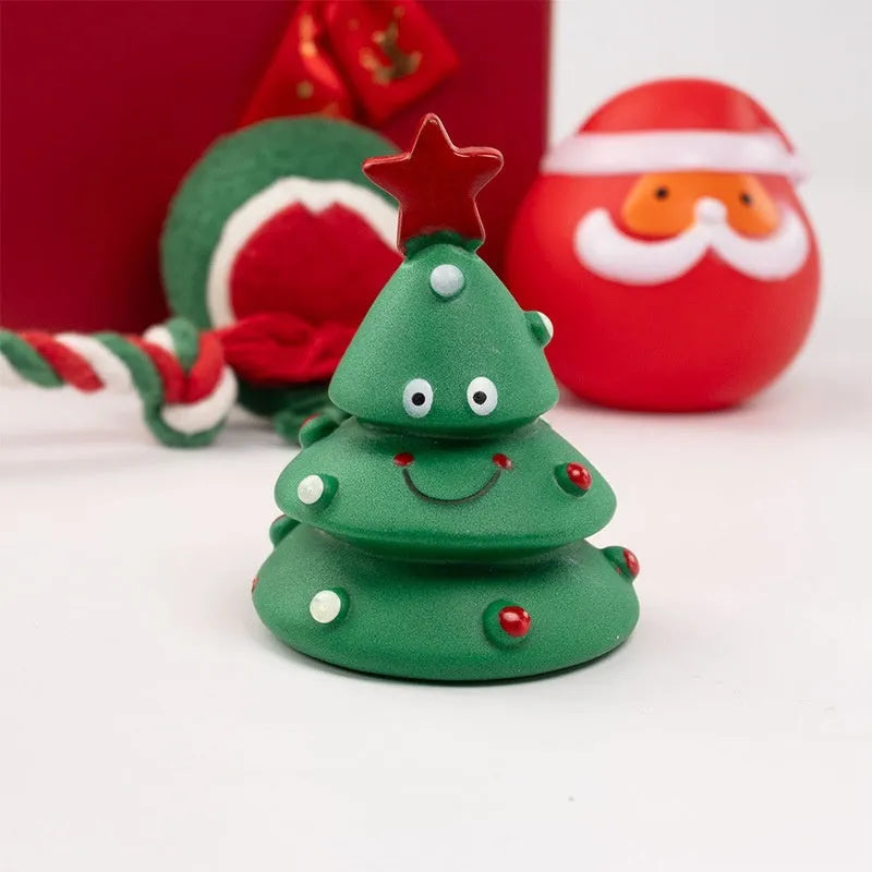 Christmas vinyl dog toy set with Santa Claus heads, trees, tennis balls, and bite ropes