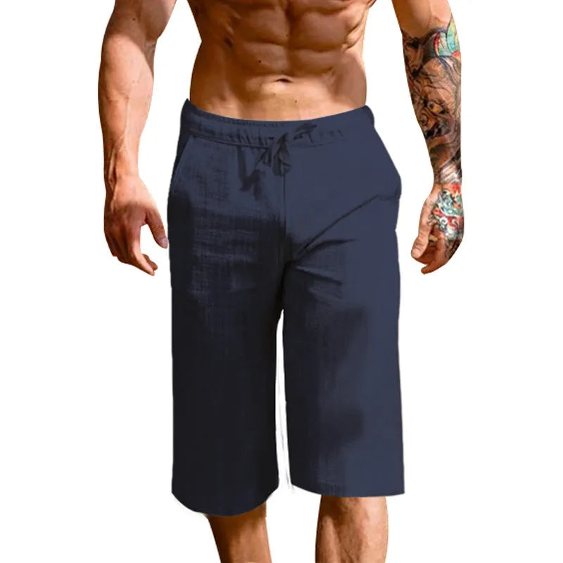 Men's loose linen blend cropped pants in khaki, shown on model, mid-waist straight leg