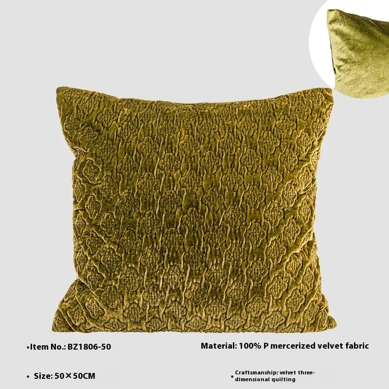 Brown gold antique style three-dimensional quilted cushion pillow on a sofa.