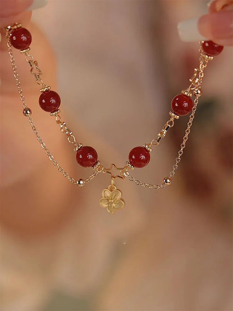 Red agate double layer bracelet with peach blossom charm and manual craftsmanship details