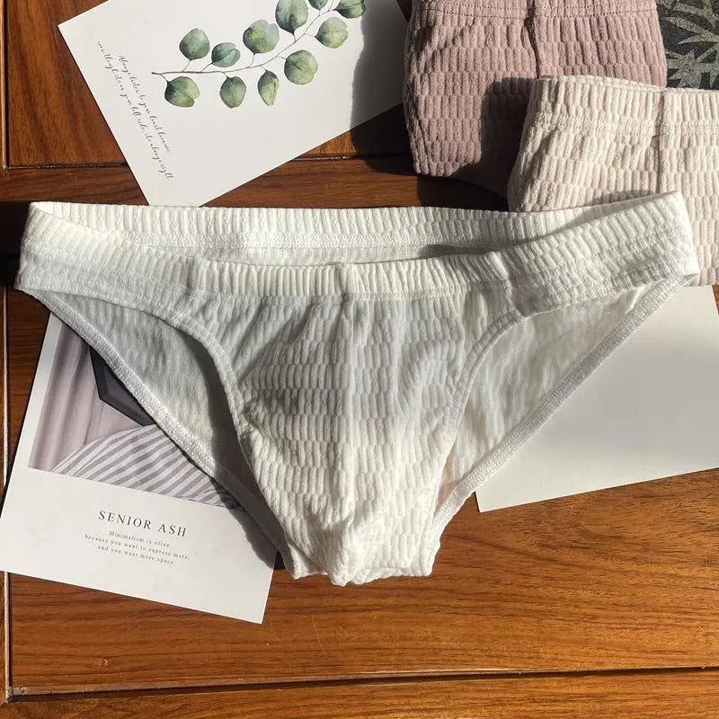 Men's solid colour pure cotton triangle briefs with a mid-waist body-shaping design.