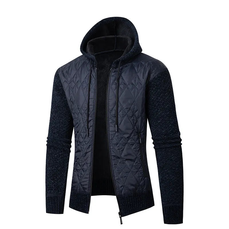 Man wearing a grey hooded zip-front cardigan made of textured wool corduroy with a cinched waist.