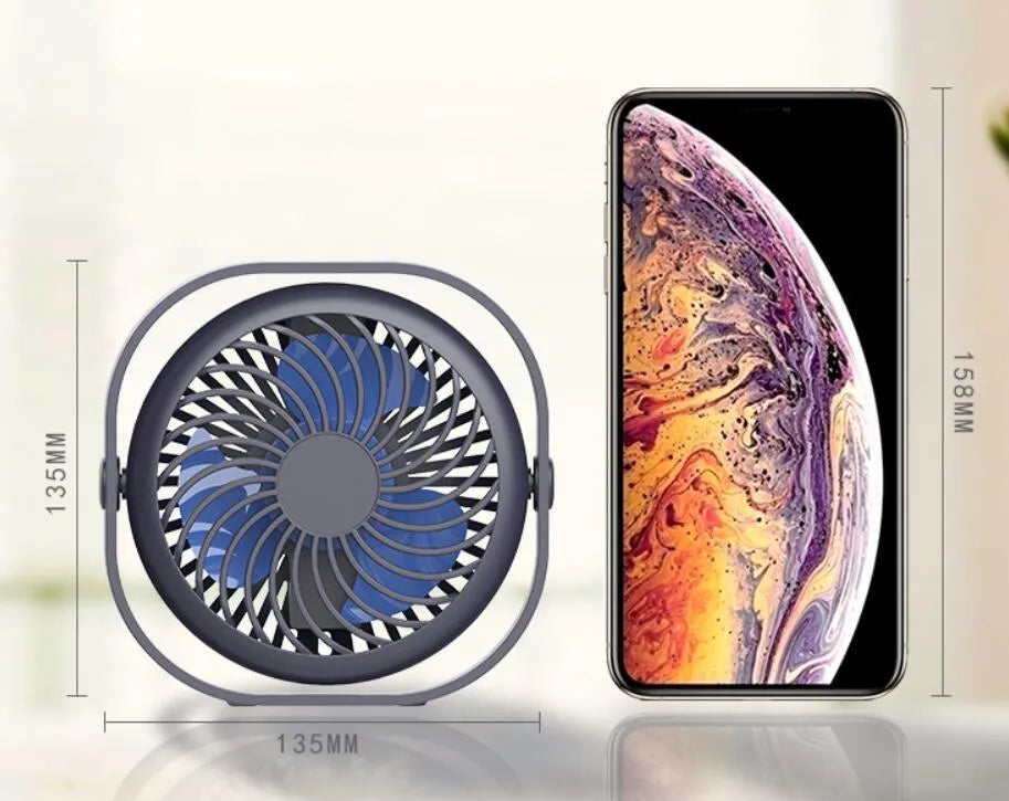 USB desk fan with rotating head in modern alarm clock design on desk