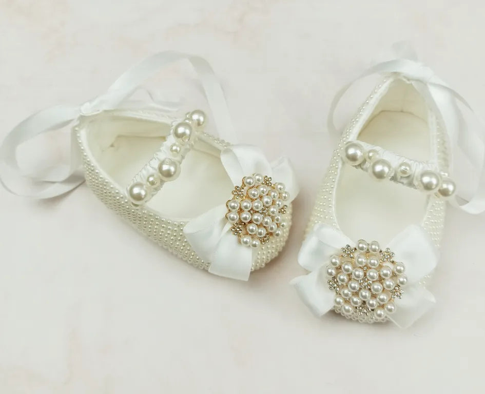 Milky white handmade soft sole cloth princess shoes with pearl detailing and lace-up closure for babies