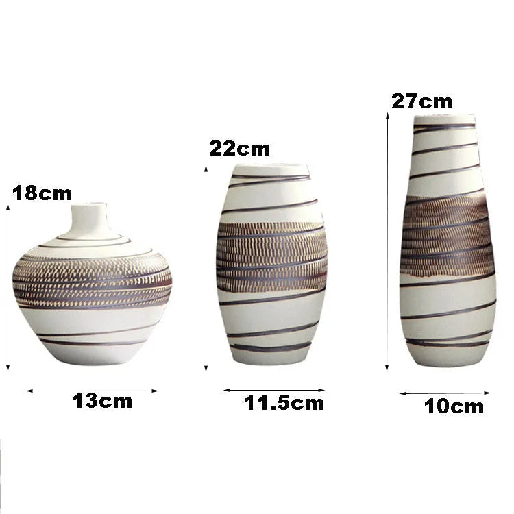 Three-piece ceramic vase set in low, medium, and tall sizes with vintage finish on a tabletop