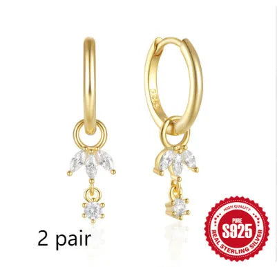 Pair of S925 sterling silver earrings with a sunflower geometric design and golden three diamonds.