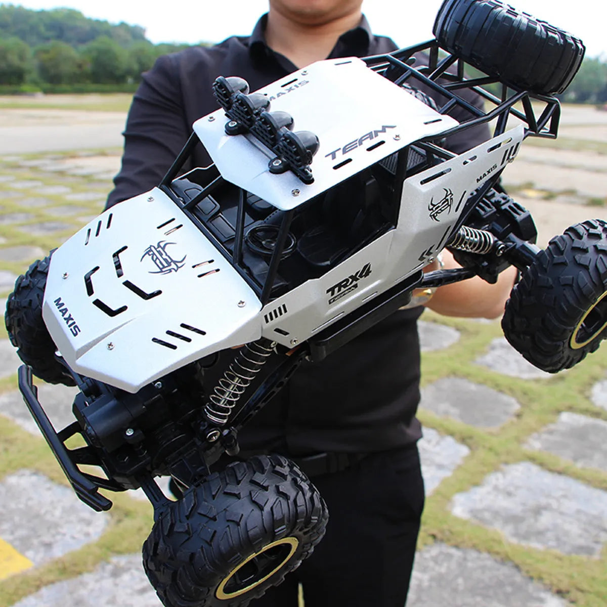 Large black 4WD remote control off-road climbing car with 2.4G wireless controller