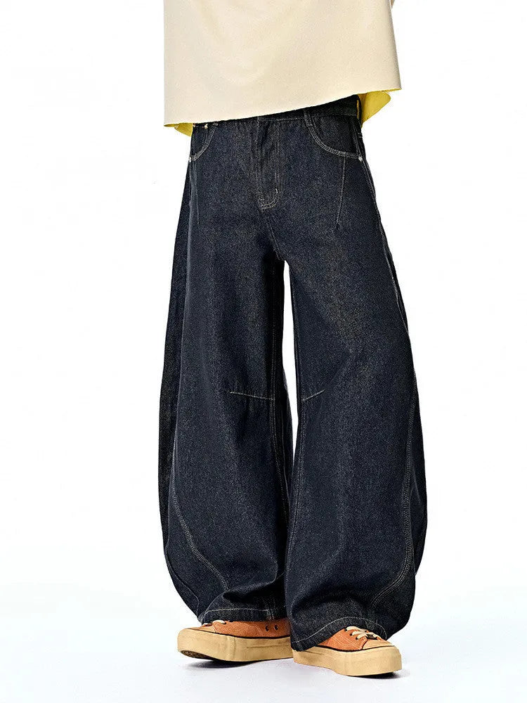 Men's wide leg denim trousers in original cow colour, showing relaxed fit and mid waist design
