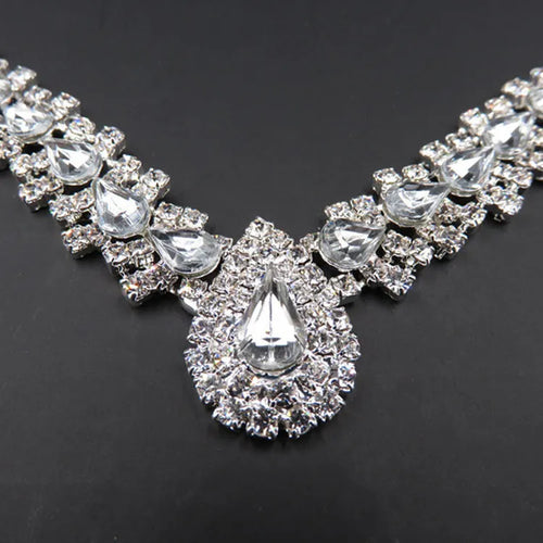 Bride wedding accessories earrings set with drop necklace on display