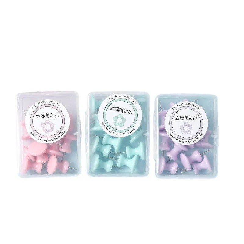 Plastic push pins in cherry blossom pink, mint green, and lavender, showing large and small sizes in a box.