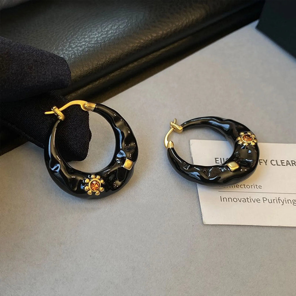 A pair of retro Hong Kong style alloy ear studs with rhinestone inlay, shown in black and red colour options.