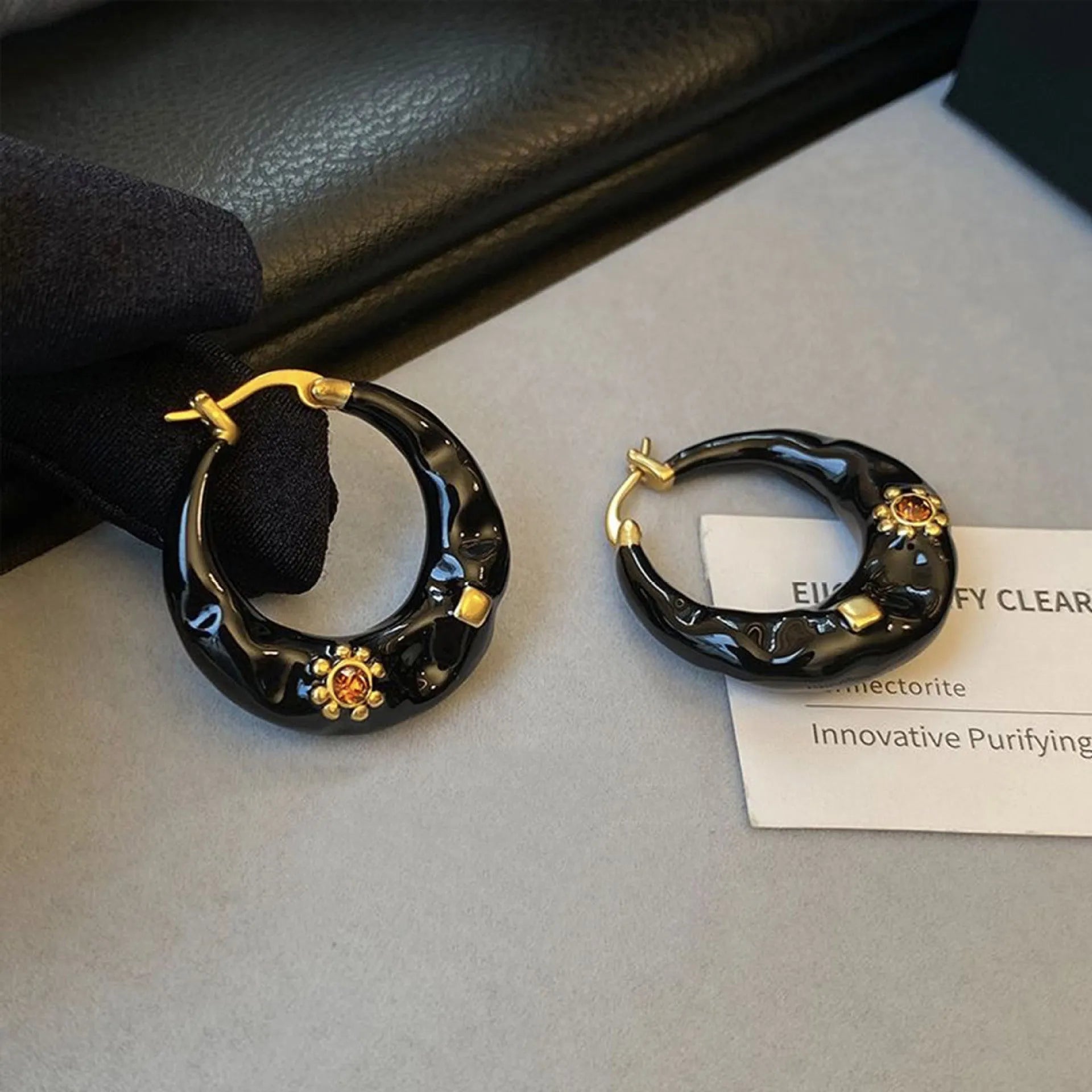 A pair of retro Hong Kong style alloy ear studs with rhinestone inlay, shown in black and red colour options.