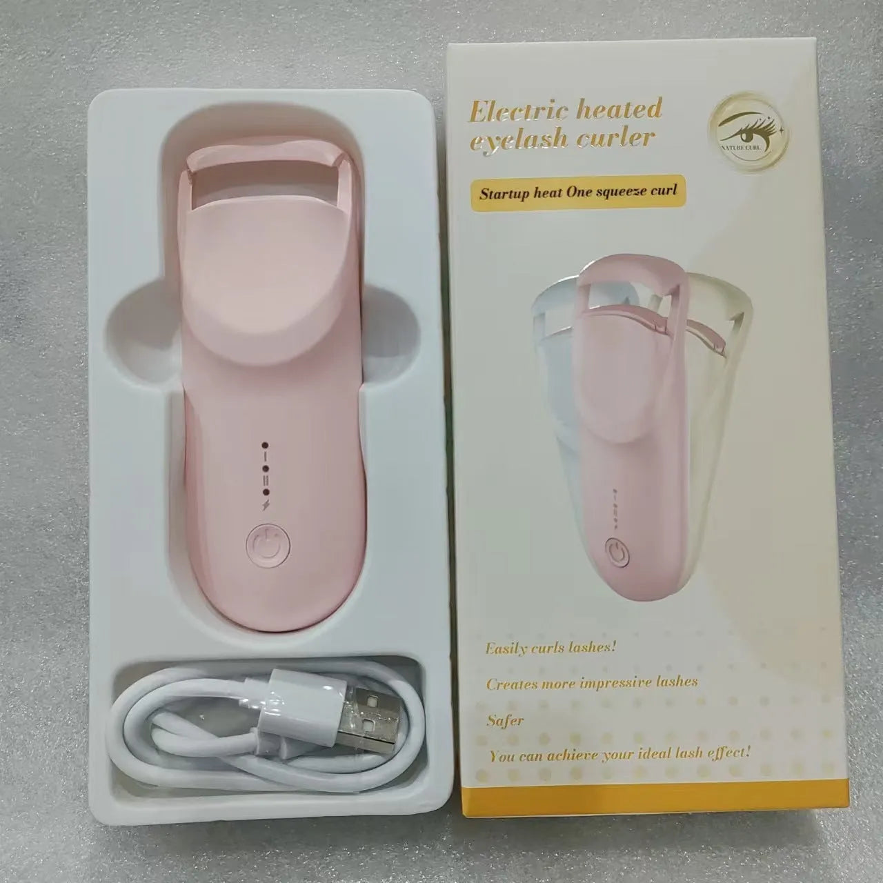 USB-C rechargeable electric eyelash curler in cream white, pink, or apricot with charging cable