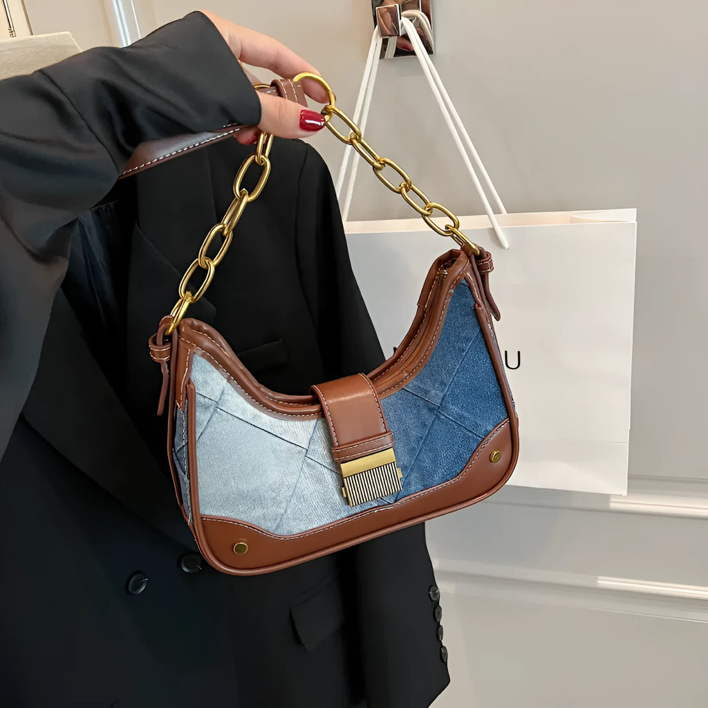 Brown denim bucket shoulder bag with diamond mesh pattern and chain decorative elements