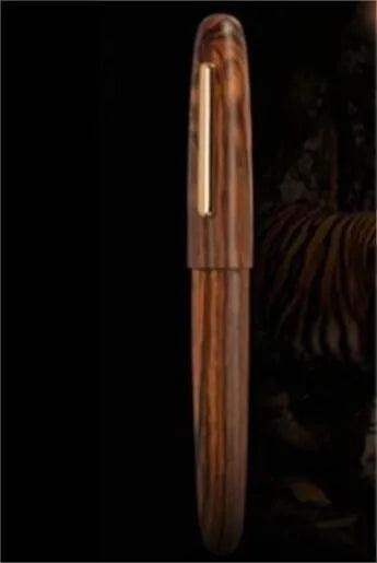 Wooden fountain pen with rotating cap showing choice of ebony, rosewood and tiger ebony finishes