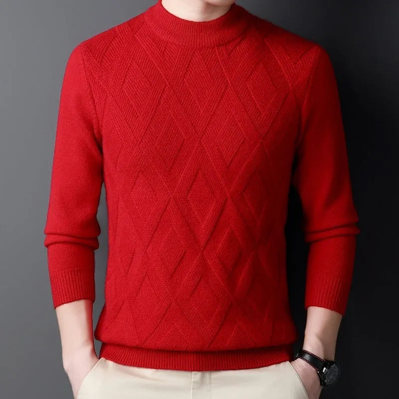 Man wearing a thick grey diamond jacquard knit pullover sweater.