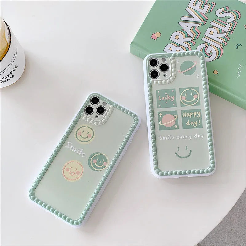 Green TPU phone case with geometric smiley face and polka dot frame design for iPhone.