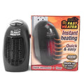 Compact black ceramic electric heater with digital display and rotating plug on a desk