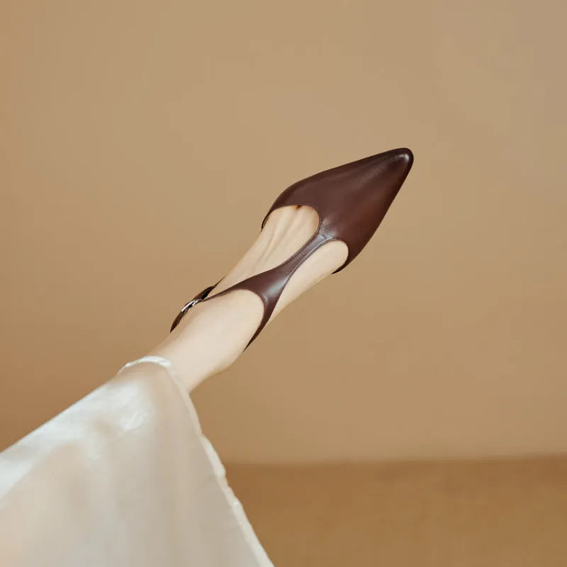 Women's vintage brown high heel shoe with a pointed toe and cowhide upper