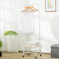 White single rod pulley clothes storage organiser mounted on a door for hanging trousers and ties.