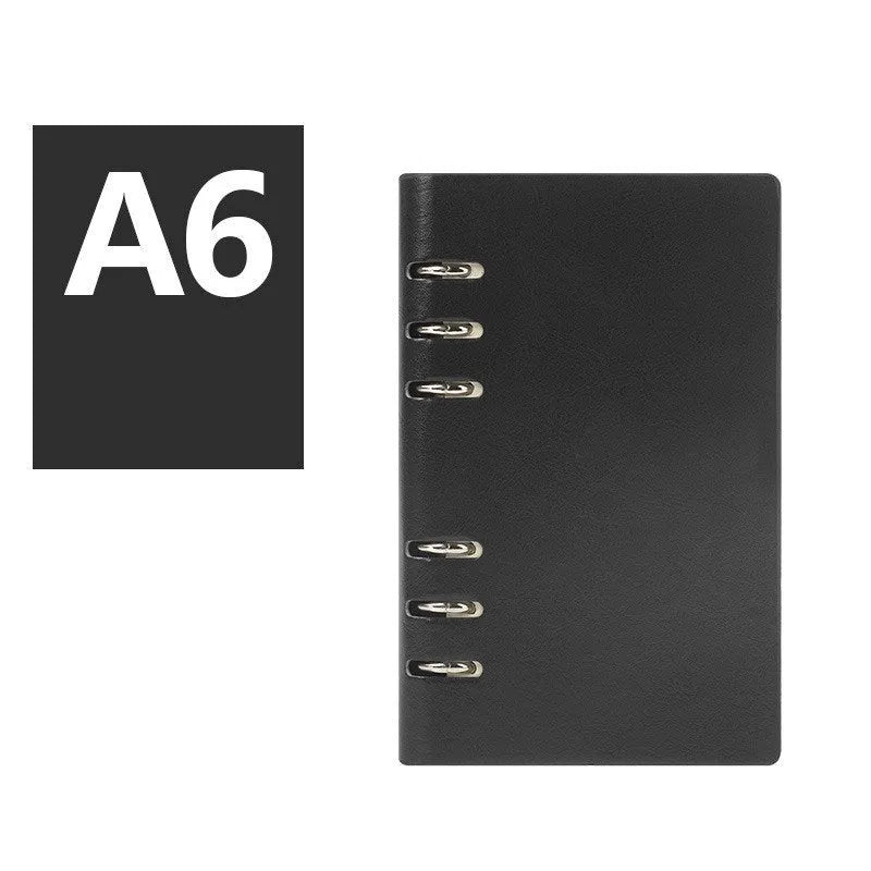 Loose-leaf business notebook with imitation leather cover in multiple colours, open to show beige paper.