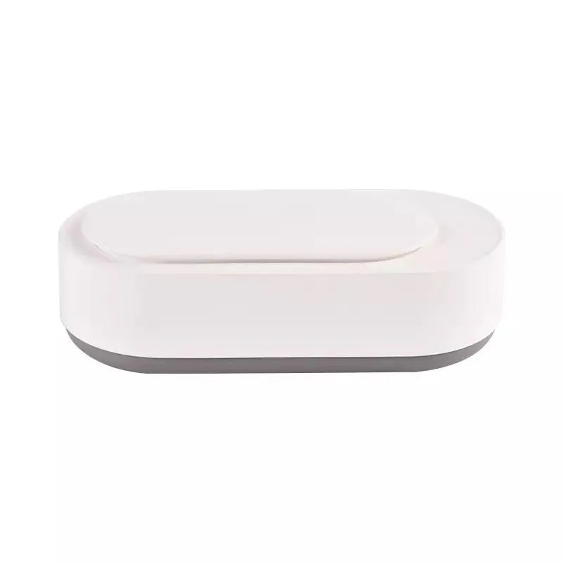 White portable ultrasonic cleaning machine with a stainless steel tank for jewellery and glasses.