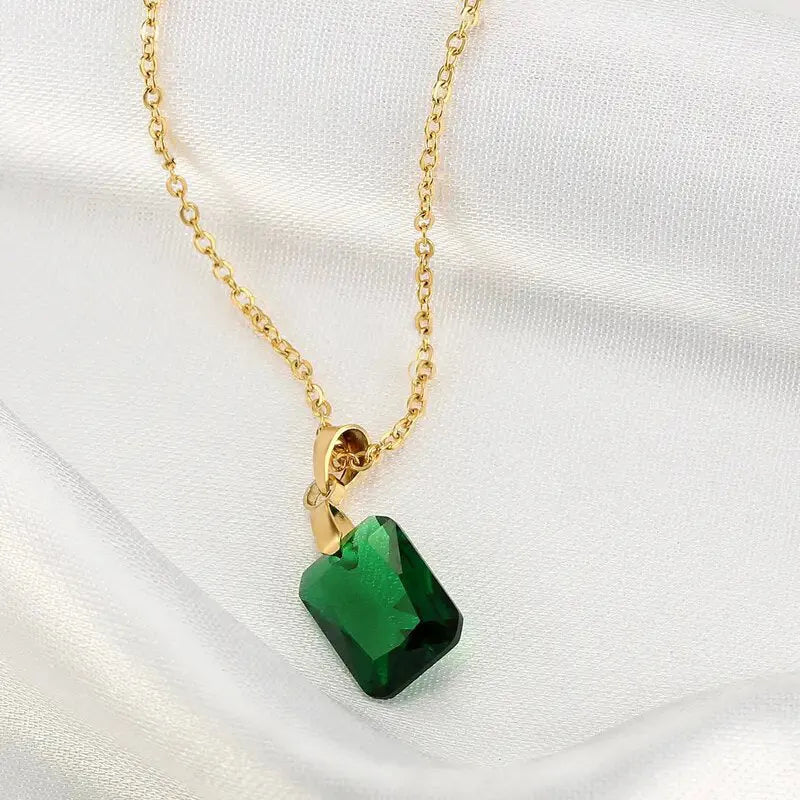 Rectangular green copper geometric pendant necklace on an O-ring chain.