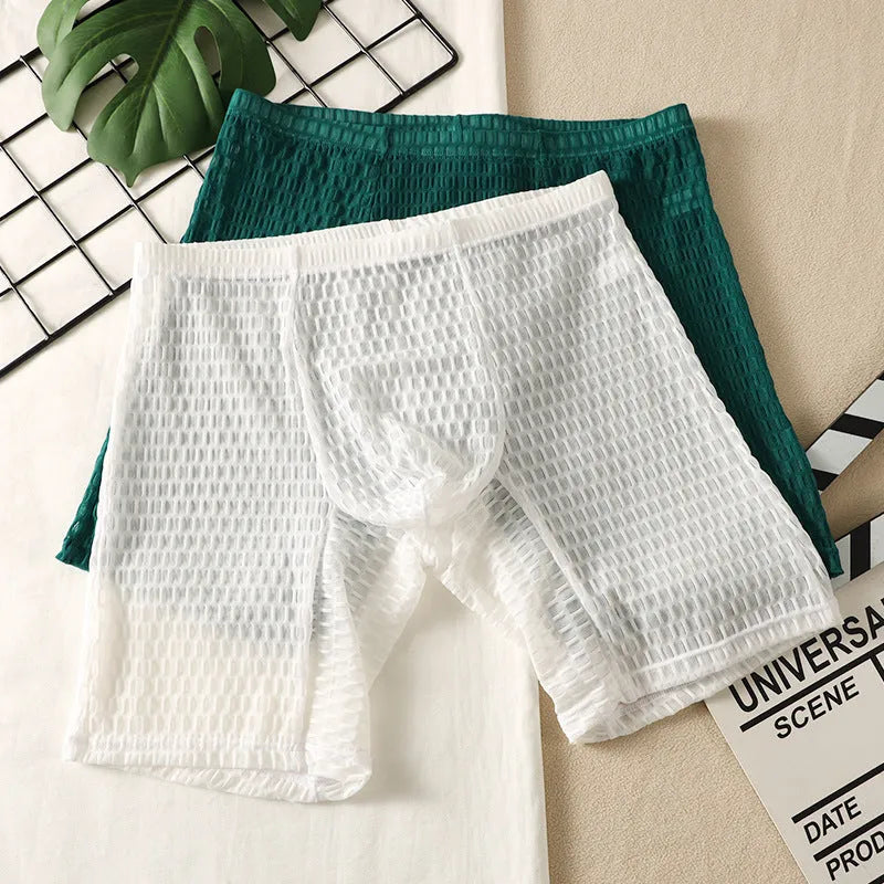 Men's solid colour lace boxer shorts on a white background, showing the textured fabric and hip-lifting shape.