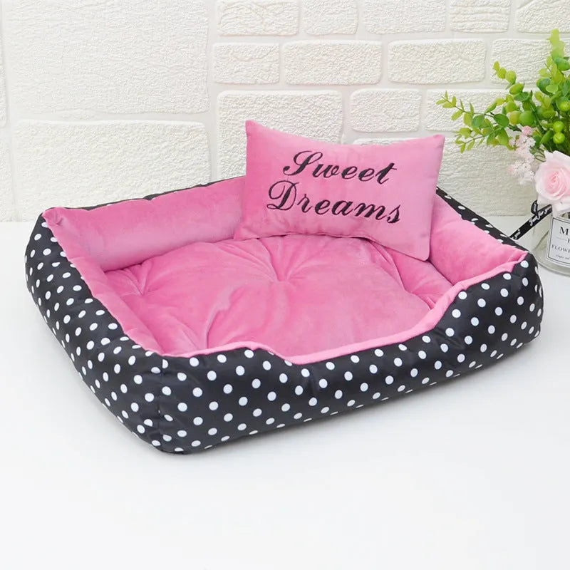 Small polka dot print dog bed with a square cushion, shown in grey colour.
