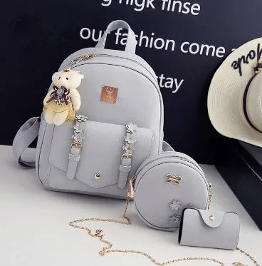 Women's fashion 3-piece bag set including backpack, shoulder bag, and card bag in floral PU leather design