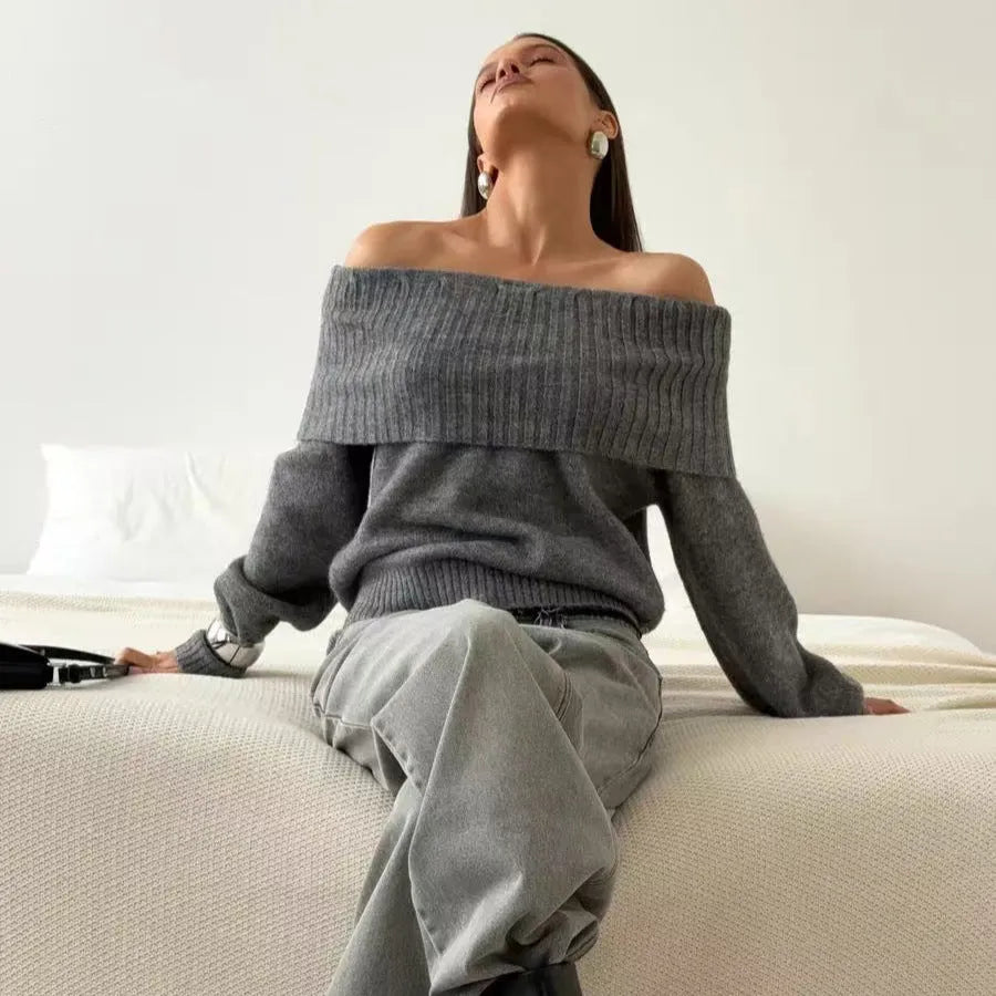 Grey off-the-shoulder strapless sweater with a 3D textured pattern and regular sleeves.