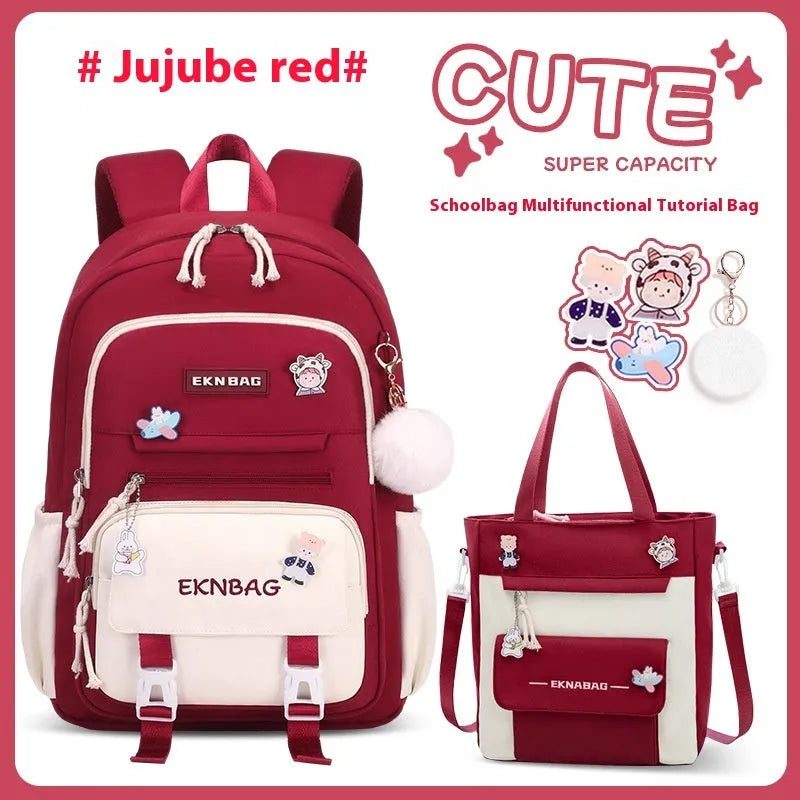 Pink waterproof Oxford cloth school backpack for girls with curved shoulder straps on a white background.