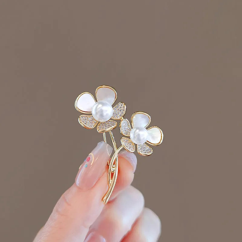 Alloy brooch in natural flower shape with electroplated finish, featuring adjustable and anti-exposure pin closure for women's coats and suits.