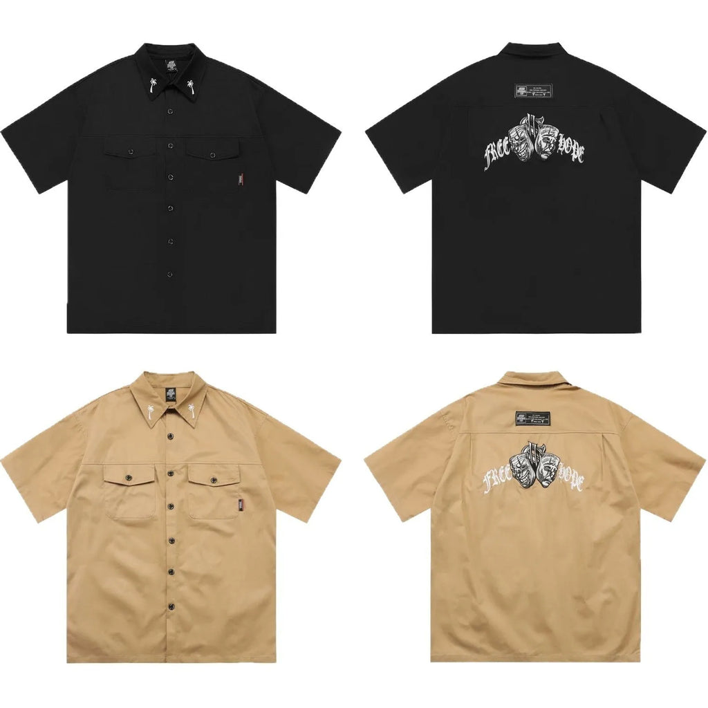 Men's black plus-size loose fit work shirt with a chest pocket and embroidered detail on the sleeve.