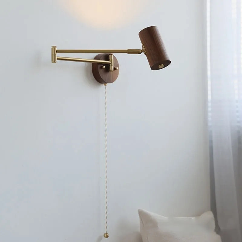 Retro style wall lamp with a long rotating metal arm and a conical shade, shown in a walnut wood finish.