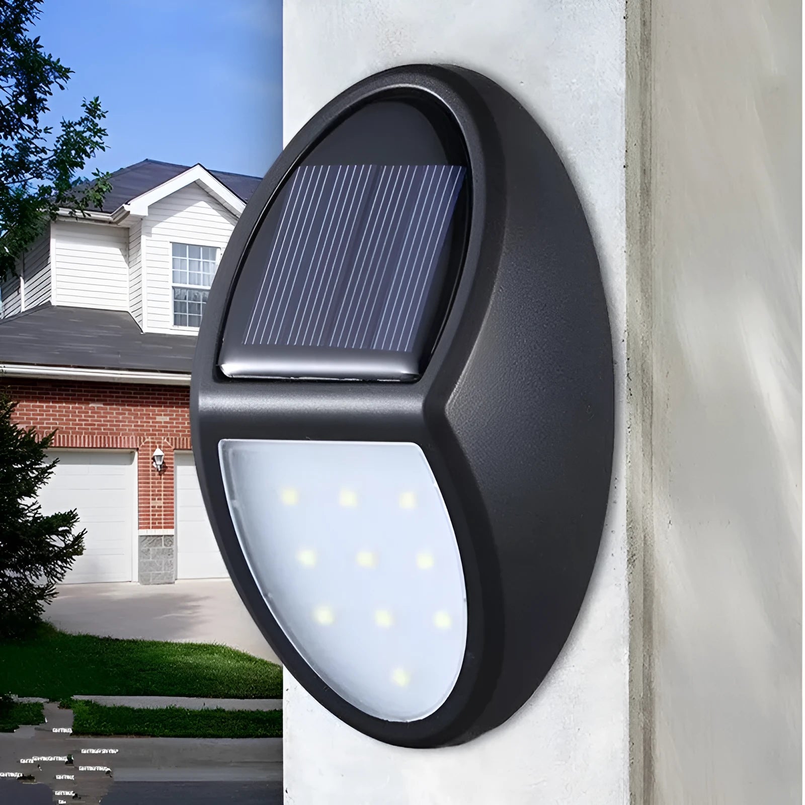 Black rectangular LED solar-powered outdoor wall light mounted on a fence.