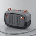 Compact portable Bluetooth mini speaker with USB port and control buttons, shown in black.