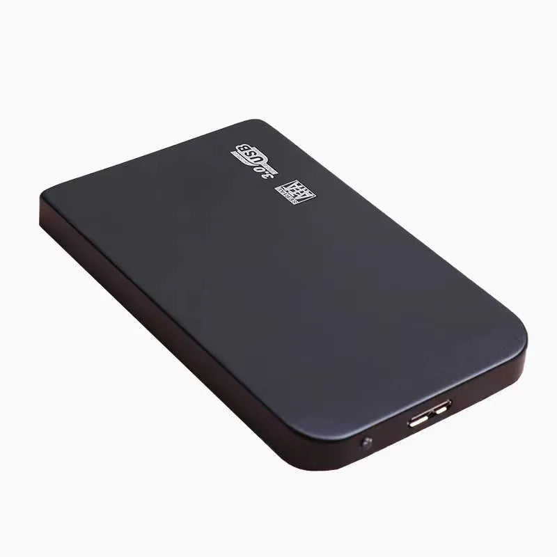 Silver metal external solid state drive with USB cable and cover next to packaging.