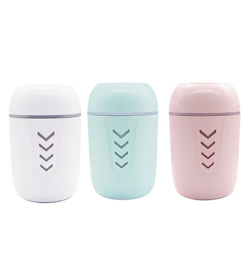 X3 portable car humidifier in columnar shape, shown in blue, pink, and white colour options.