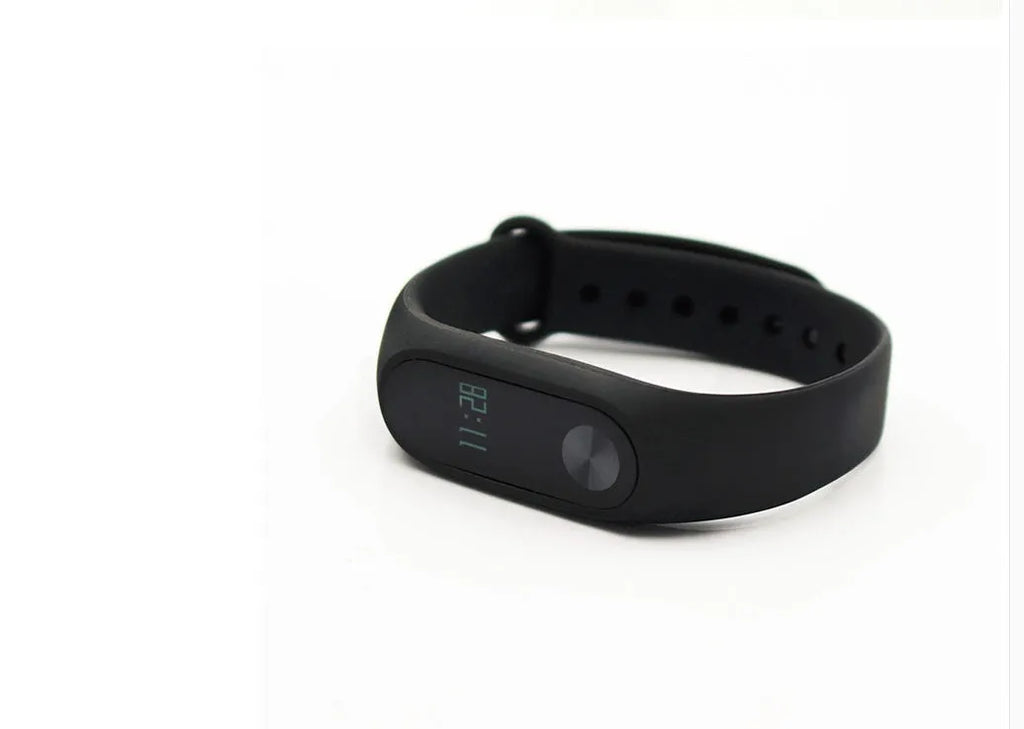 Xiaomi Mi Band 2 black fitness tracker on wrist showing OLED display
