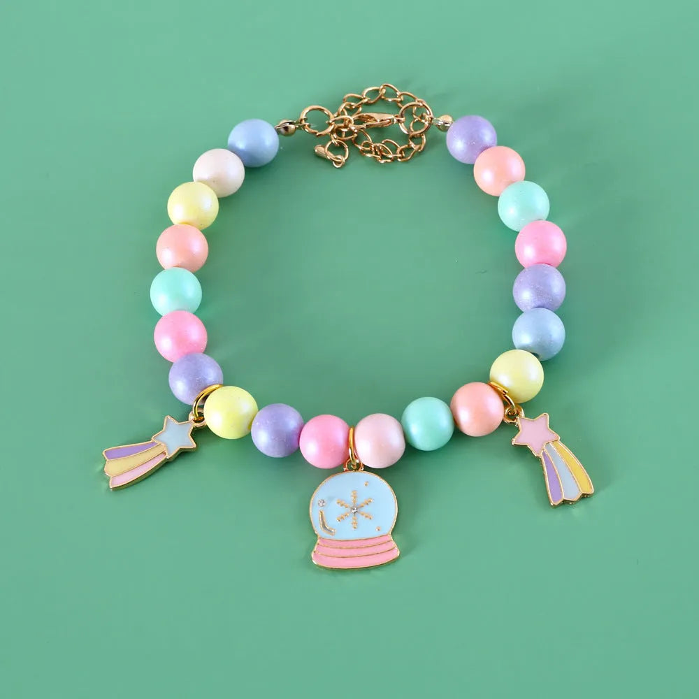 Colourful macaron charm pet collar and matching bracelet set in resin on a white background.