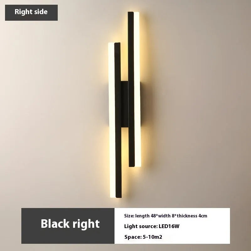 Modern Scandinavian minimalist LED wall light with acrylic shade in black or gold finish.