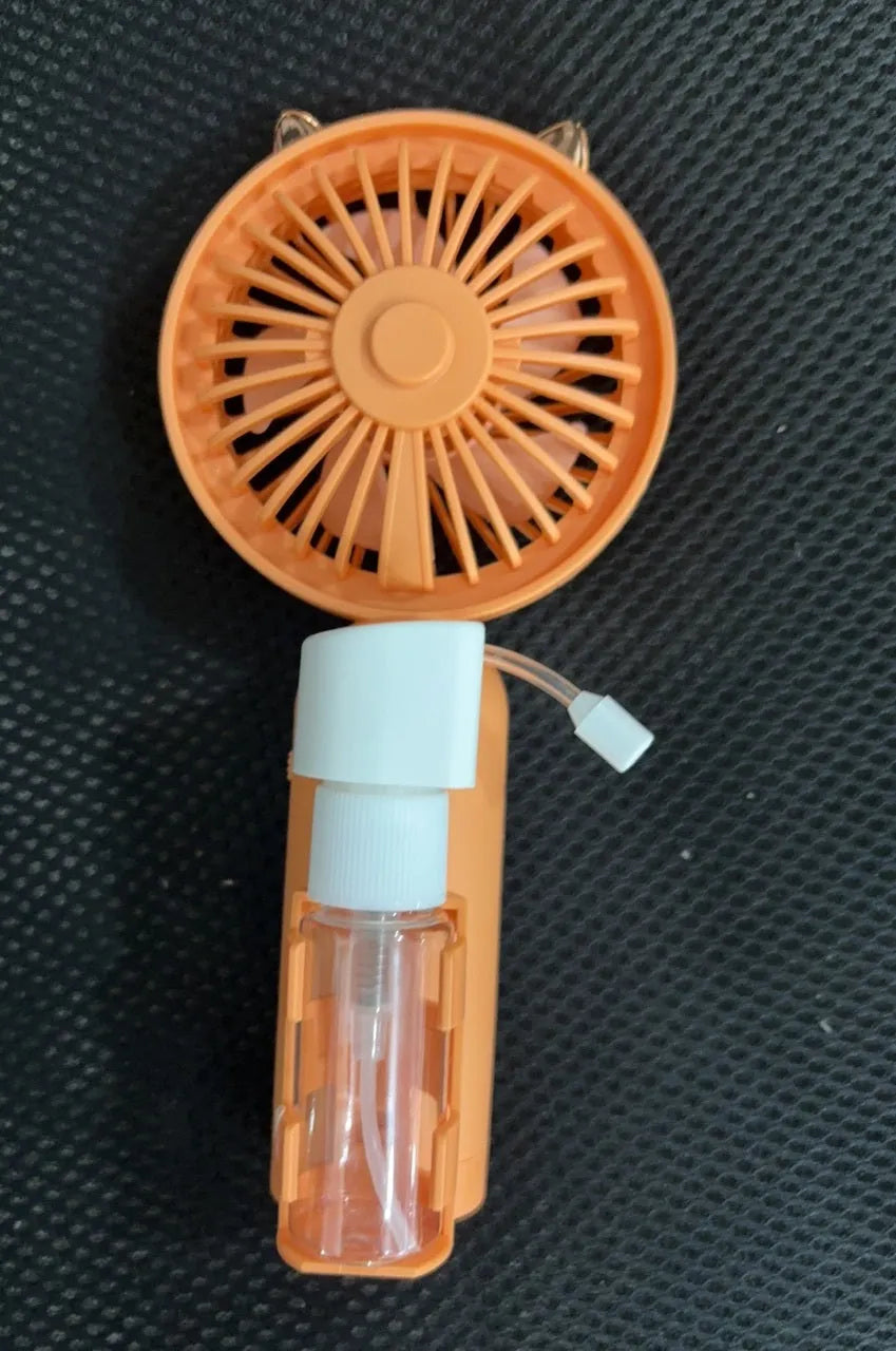 Small plastic nozzle fan in apricot colour with USB charging port