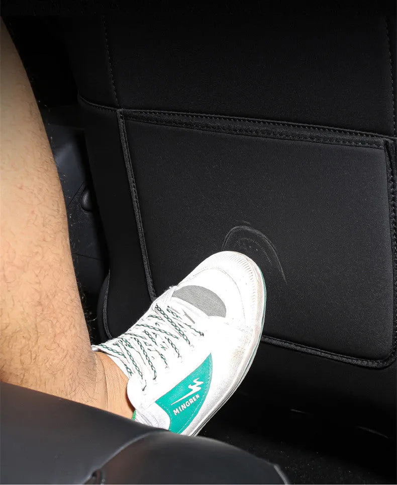 Black leather anti kick pad for car seat back protection, showing single pocket.