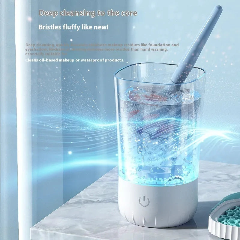 White rechargeable electric makeup brush cleaner with plastic construction and charging cable