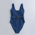 Navy blue women's one-piece swimsuit with triangle neckline and built-in chest pads