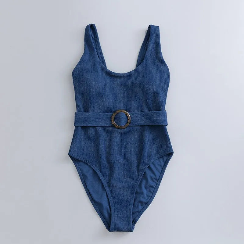 Navy blue women's one-piece swimsuit with triangle neckline and built-in chest pads
