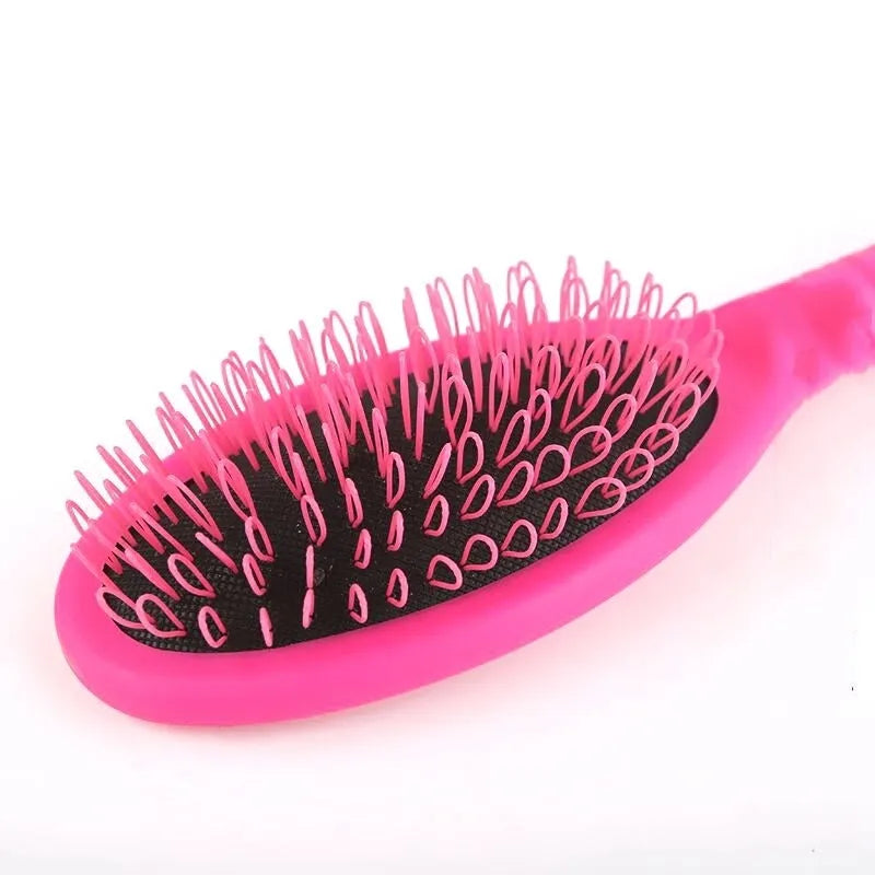 Black ring tooth plastic comb with airbag feature for hair extensions, shown next to a pink version.
